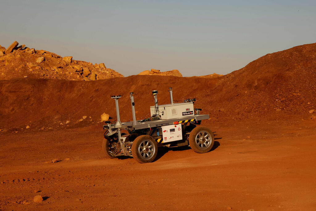 A robotic rover moves during a training mission for planet Mars at a site that simulates an off-site station at the Ramon Crater in Mitzpe Ramon in Israel's southern Negev desert on October 10, 2021
