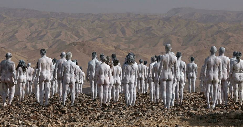 Models pose nude for American art photographer Spencer Tunick in the desert landscape surrounding the southeastern Israeli city of Arad, near the Dead Sea