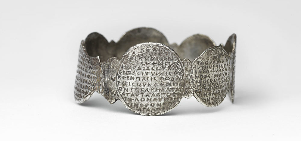 Amulet-armband inscribed with the first two paragraphs of the Shema prayer and Psalm 91:1 in Greek. The armband dates back to the sixth-to-seventh century and is originally from Israel or Egypt.