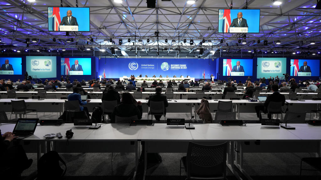 President of the United Nations General Assembly Abdulla Shahid is seen on screen as he speaks at the start of UN Climate Change Conference (COP26) in Glasgow