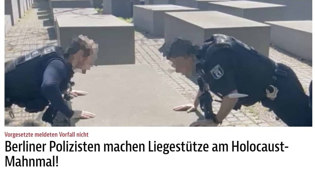 German policemen doing push-ups at Berlin's Holocaust memorial
