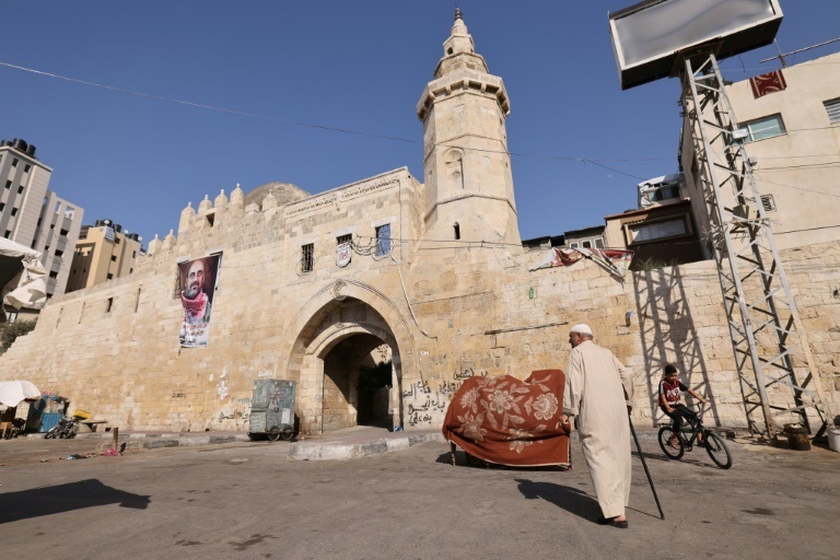 Barbakh walks in front of Khan Yunis's 13th Century Barquq Castle where he said dozens of bodies killed by Israeli troops were left outside the walls (Photo: AFP) Barbakh walks in front of Khan Yunis's 13th Century Barquq Castle where he said dozens of bodies killed by Israeli troops were left outside the walls