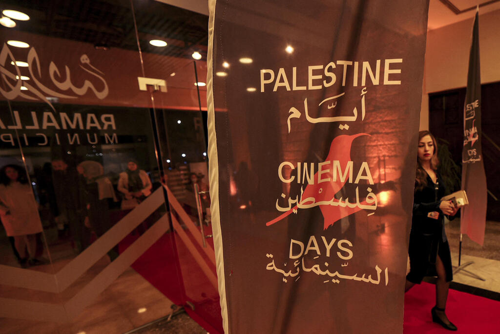 A Palestinian attends the opening of the Palestine Cinema Days festival in Ramallah