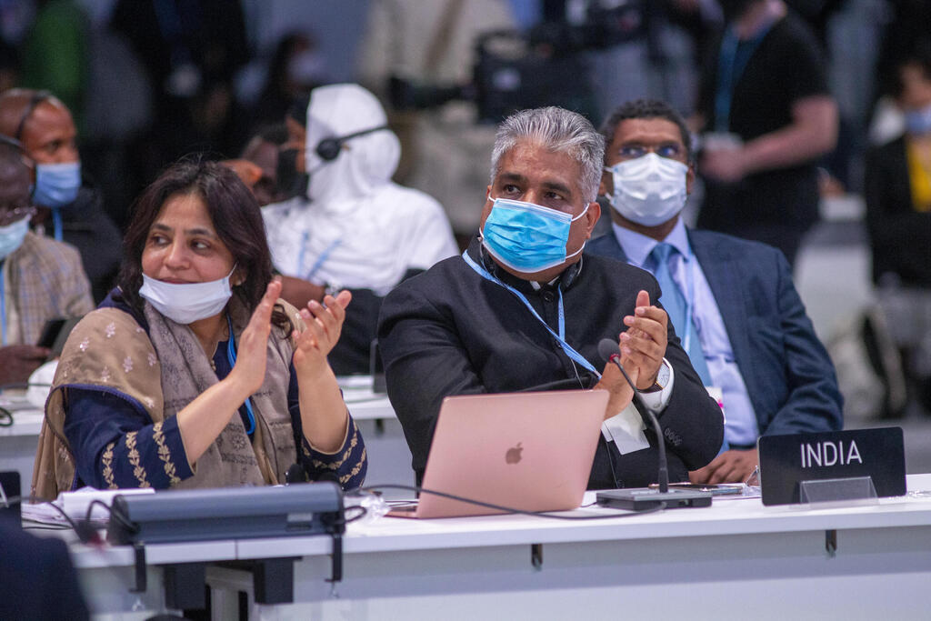 India delegates clap during closing session of climate change conference 