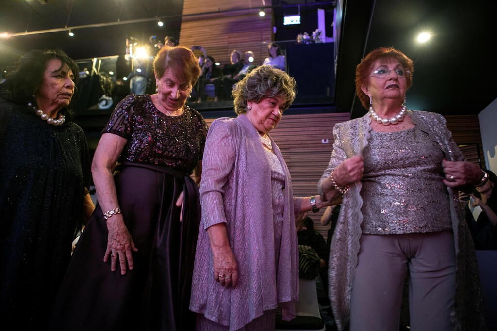 Salina Steinfeld, Chaya Kleinman, Chedva Raver and Yehudit Shabtai, Holocaust survivors and participants prepare to go on stage during the annual Holocaust survivors' beauty pageant