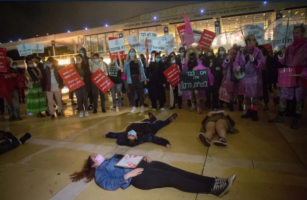 Activists protest against cases of violence against women at Habima Square in Tel Aviv, November 25, 2020