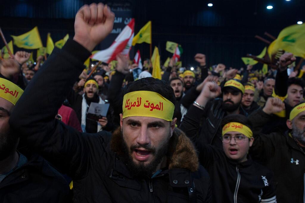 Supporters of Hezbollah leader Sayyed Hassan Nasrallah chant slogans in a southern suburb of Beirut, Lebanon 