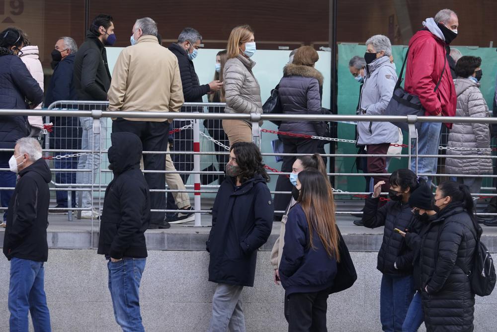People queue for Pfizer COVID-19 vaccinations in the Wizink Center in Madrid, Spain 
