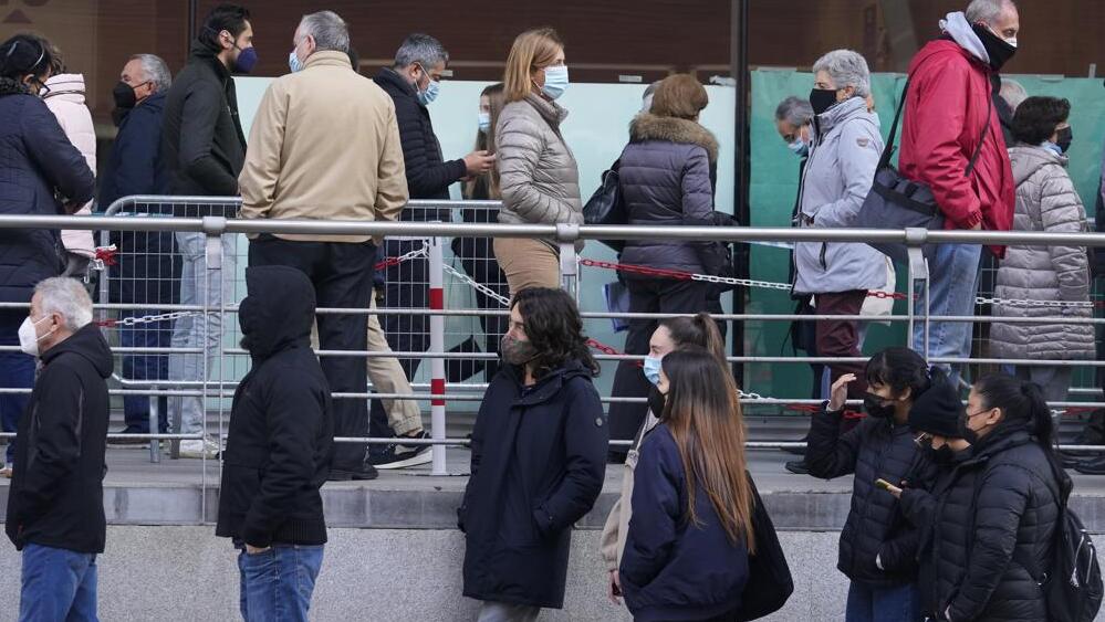 People queue for Pfizer COVID-19 vaccinations in the Wizink Center in Madrid, Spain 