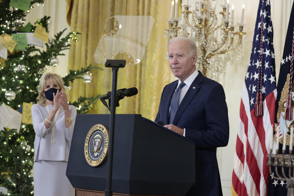 President Joe Biden delivers remarks before a menorah lighting ceremony in celebration of Hanukkah in the East Room of the White House
