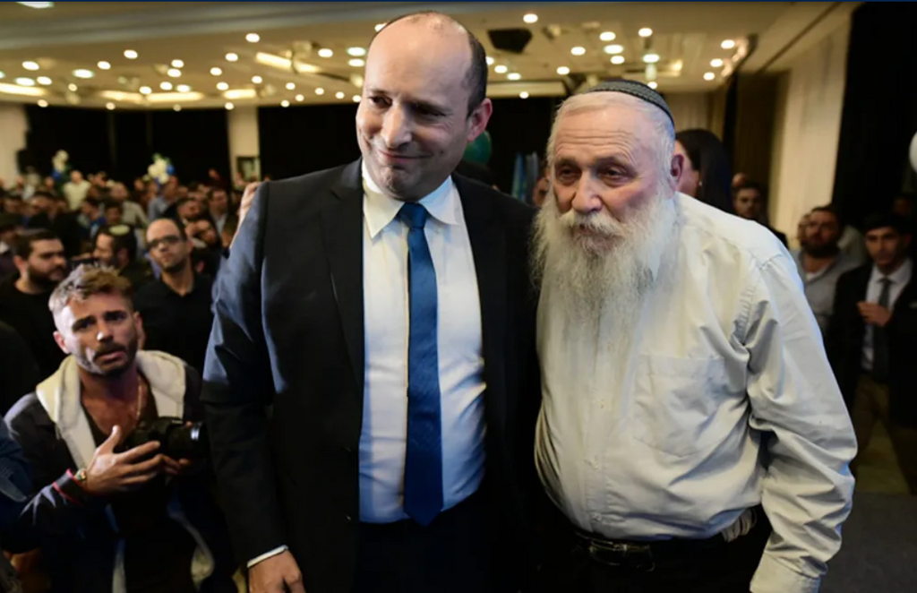 Rabbi Haim Drukman and Prime Minister Naftali Bennett attend the campaign launch of the right-wing Yamina party, ahead of the general elections, February 12, 2020