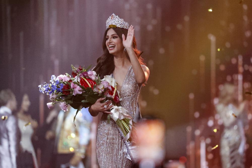 India's Harnaaz Sandhu waves after being crowned Miss Universe 2021 during the 70th Miss Universe pageant 