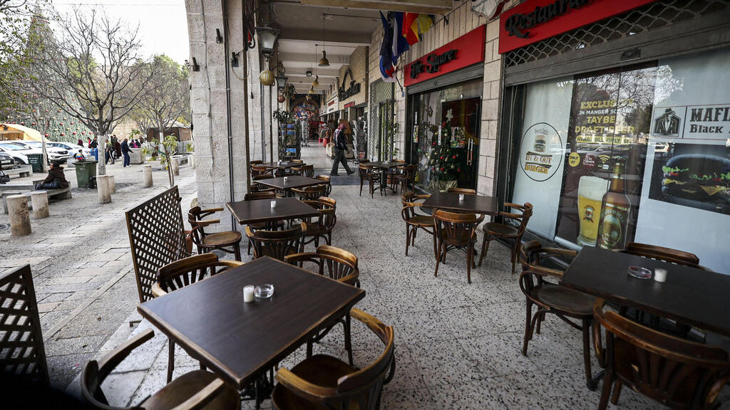 This picture taken on December 15, 2021 shows a view of an empty restaurant in the biblical West Bank city of Bethlehem 