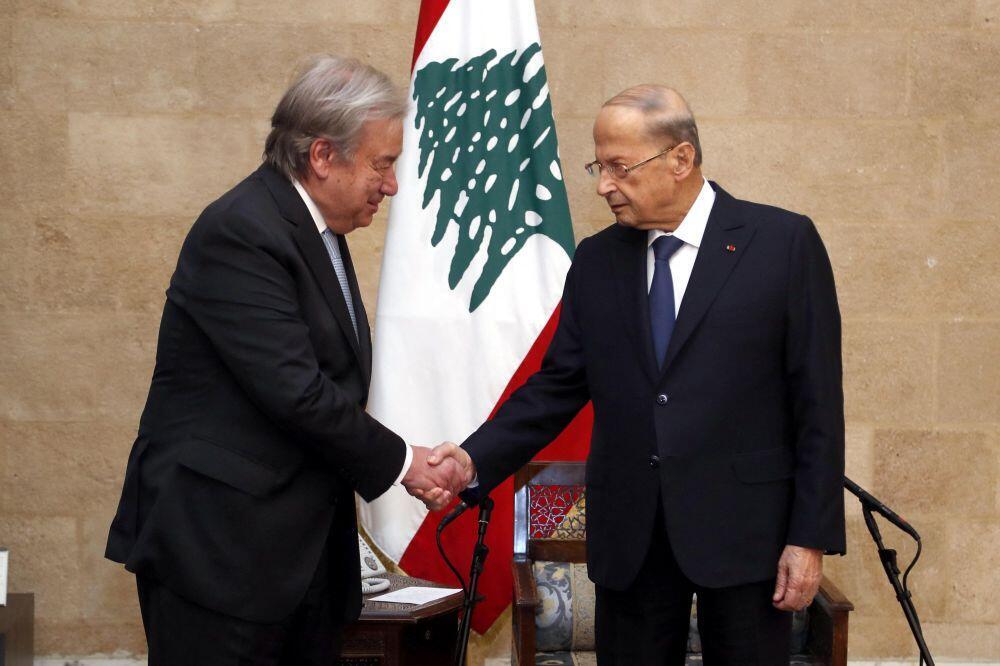 Lebanon's President Michel Aoun (R) greeting UN Secretary-General Antonio Guterres during a visit to the presidential palace in Baabda, east of the capital Beirut 