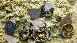 המטבעות העתיקים כפי שנתגלו במים