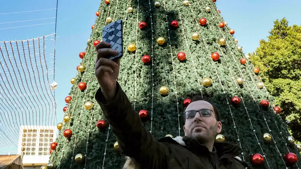 Ayyad taking selfie in Manger Square (Photo: AFP) Ayyad, taking a "selfie" in Manger Square