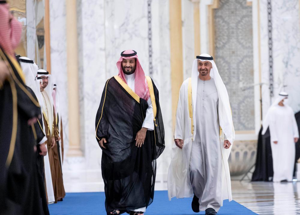 Saudi Crown Prince Mohammed bin Salman, left, and Abu Dhabi's powerful crown prince, Sheikh Mohammed bin Zayed Al Nahyan, walk into a reception in Abu Dhabi, United Arab Emirates 