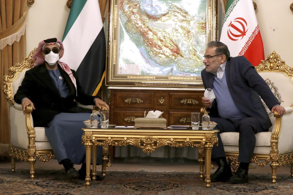Secretary of Iran's Supreme National Security Council Ali Shamkhani, right, speaks with United Arab Emirates' top national security adviser Sheikh Tahnoon bin Zayed Al Nahyan during their meeting in Tehran, Iran 