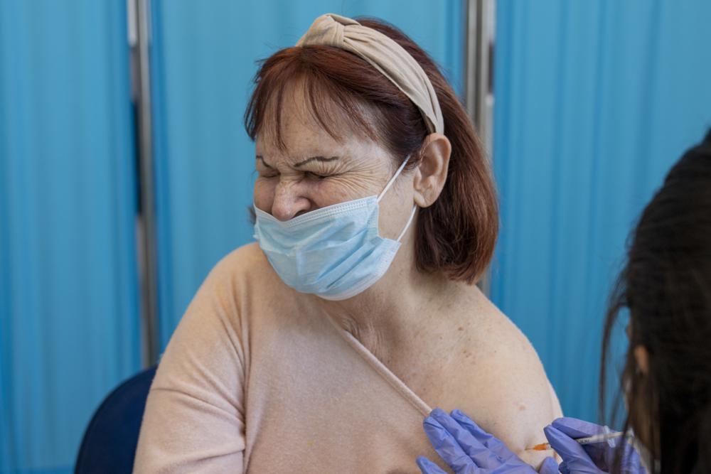 Judit Kagan, 75, receives her fourth dose of the coronavirus vaccine in a private nursing home in Petah Tikva 