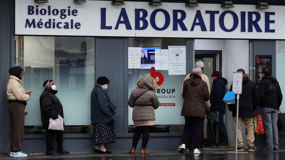 People queue for COVID-19 tests in front of a laboratory in Paris amid the spread of the coronavirus disease (COVID-19) pandemic in France