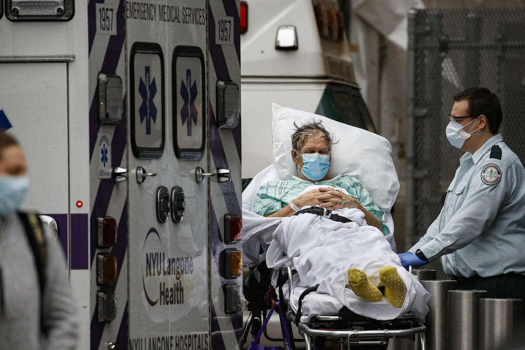 Patients and medical workers outside the emergency room at NYU Langone Medical Center, New York 
