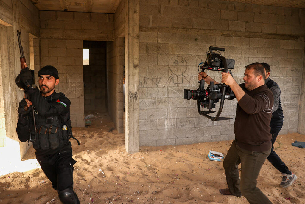 Palestinian actors and crew shoot a scene of the series by local Al-Aqsa TV "Qabdat al-Ahrar," meaning "Fist of the Free" in Arabic, in Gaza city