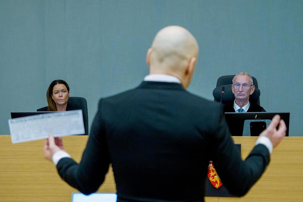 Co-judge Henriette Thoner and judge Dag Bjoervik attend the first day of the trial of mass killer Anders Behring Breivik, where he is requesting release on parole, at the makeshift courtroom in Skien prison, Skien, Norway January 18, 2022 