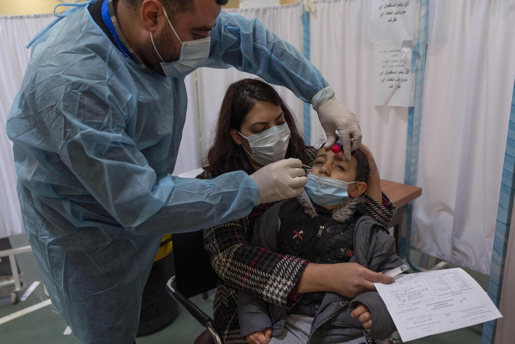 A health care worker takes a nasal swab sample from a Palestinian child in a COVID-19 testing center, in the West Bank city of Ramallah (Photo: AP) A health care worker takes a nasal swab sample from a Palestinian child in a COVID-19 testing center, in the West Bank city of Ramallah