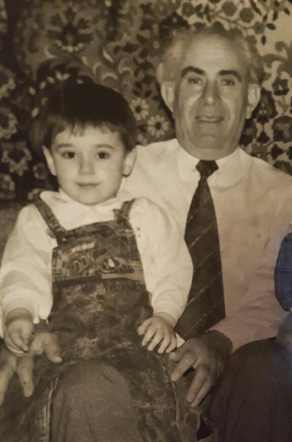 This 1990's photograph provided by author Maksim Goldenshteyn shows his grandfather Motl Braverman with Maksim Goldenshteyn sitting on his lap in Chernivtsi, Ukraine (Photo: Maksim Goldenshteyn via AP) This 199O's photograph provided by author Maksim Goldenshteyn shows his grandfather Motl Braverman with Maksim Goldenshteyn sitting on his lap in Chernivtsi, Ukraine