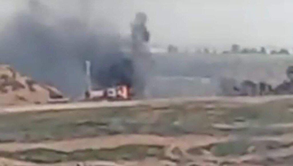 The burning vehicle at the Israel-Gaza border עשן עולה מעמדה צבאית של צה"ל על גדר המערכת עם עזה באזור אל-בורייג', מרכז הרצועה