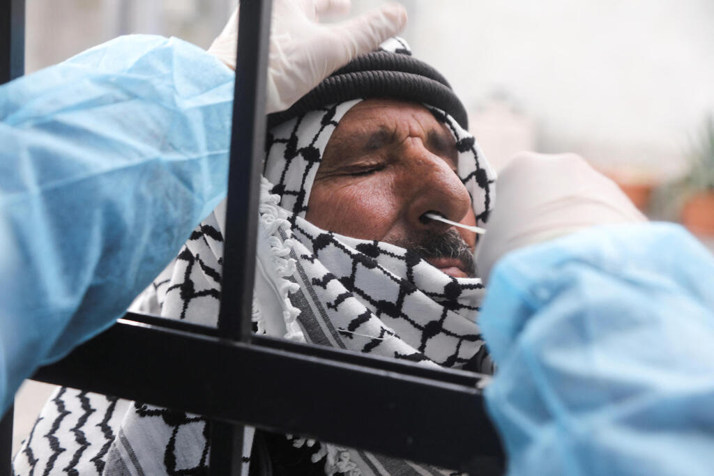 A resident of the West Bank is tested for COVID (Photo: Reuters) A resident of the West Bank is tested for COVID