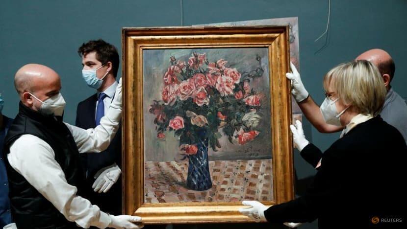 The painting "Flowers" by Lovis Corinth is returned to representative and lawyer Imke Gielen of the descendants of the Jewish couple Gustav and Emma Mayer, more than 70 years after it was plundered by the Nazis during World War two 
