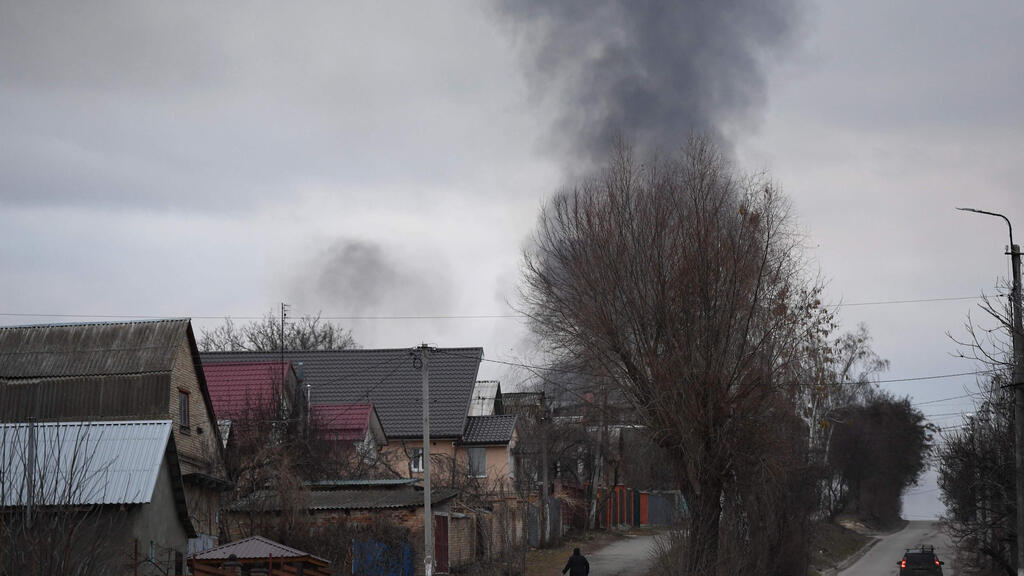 Smoke billowing from the Antonov airport outside Kyiv reported to be under Russian control on Thursday 