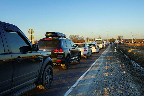 A long line of cars edging towards Ukraine's border with Poland on Friday 
