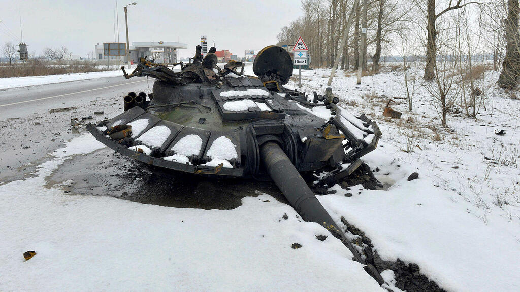  A fragment of a destroyed Russian tank is seen on the roadside on the outskirts of Kharkiv 