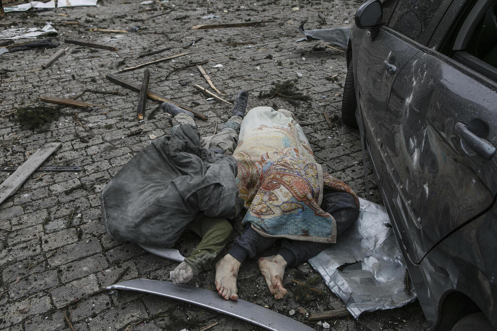 Bodies lie in the street after a Russian missile strike on Kharkiv on Tuesday 