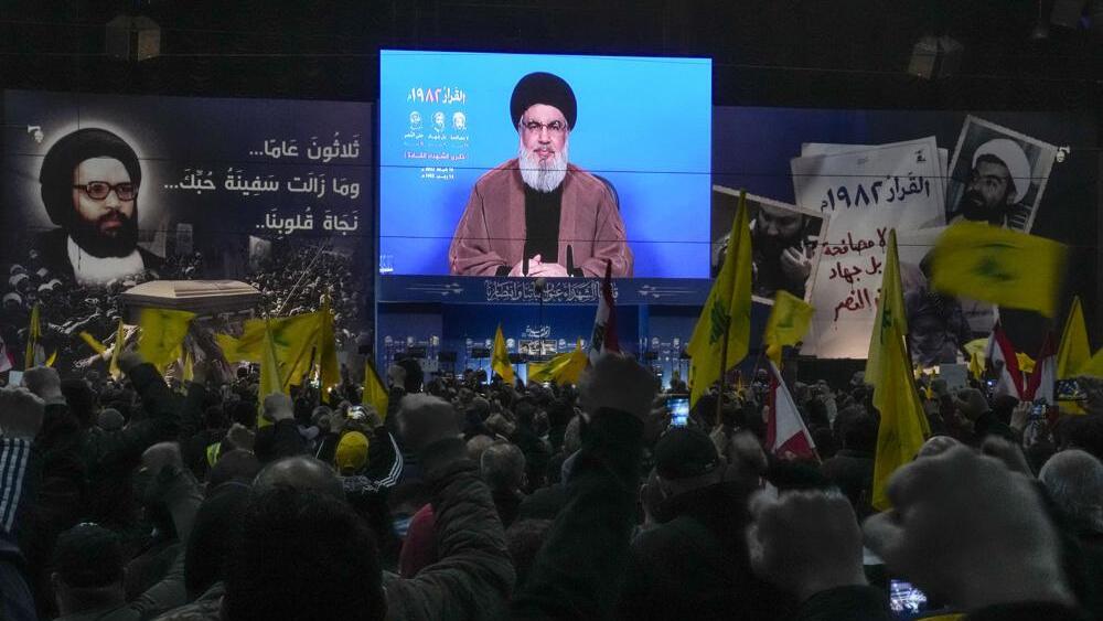 Hezbollah leader Sheik Hassan Nasrallah speaks via a video link during an annual ceremony commemorating the killing of some of the Iran-backed group's top political and military leaders 