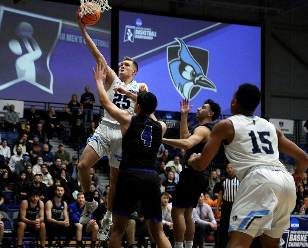 Johns Hopkins University's Lincoln Yeutter (25) reaches for a layup 