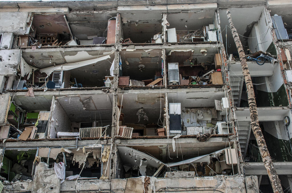 An apartment block destroyed by Russian shelling in Kharkiv 