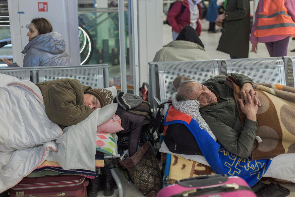 Refugees from Ukraine rest at the Central Railway Station, following Russia's invasion of Ukraine, in Warsaw, Poland, March 12, 2022 (Photo: Reuters) Refugees from Ukraine rest at the Central Railway Station, following Russia's invasion of Ukraine, in Warsaw, Poland, March 12, 2022