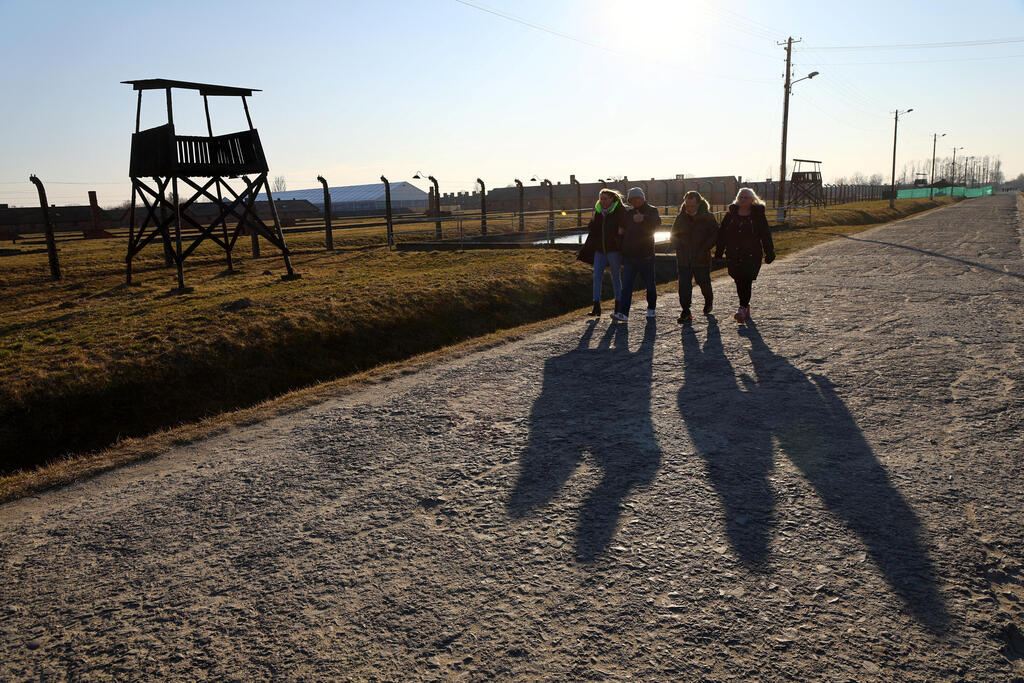 Visitors walk at the site of the former Nazi German concentration and extermination camp Auschwitz II-Birkenau, in Brzezinka near Oswiecim, Poland, March 13, 2022 (Photo: Reuters) Visitors walk at the site of the former Nazi German concentration and extermination camp Auschwitz II-Birkenau, in Brzezinka near Oswiecim, Poland, March 13, 2022