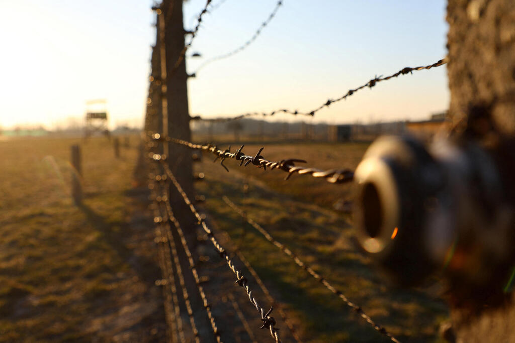 Barbed wire fence is pictured at site of the former Nazi German concentration and extermination camp Auschwitz II-Birkenau, in Brzezinka near Oswiecim, Poland, March 13, 2022