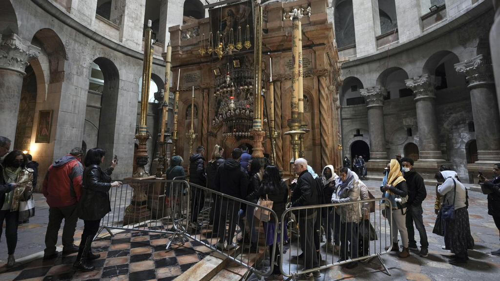 People line up at the Church of the Holy Sepulcher, in the Old City of Jerusalem, March 17, 2022