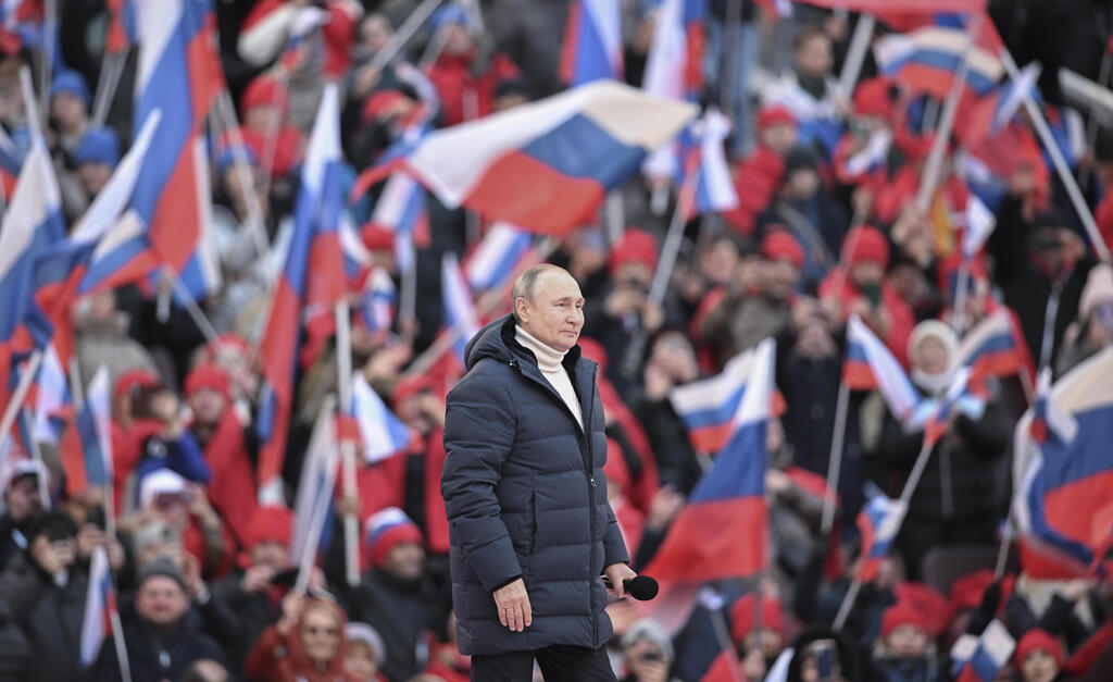 Russian President Vladimir Putin holds a rally in Moscow on Friday 