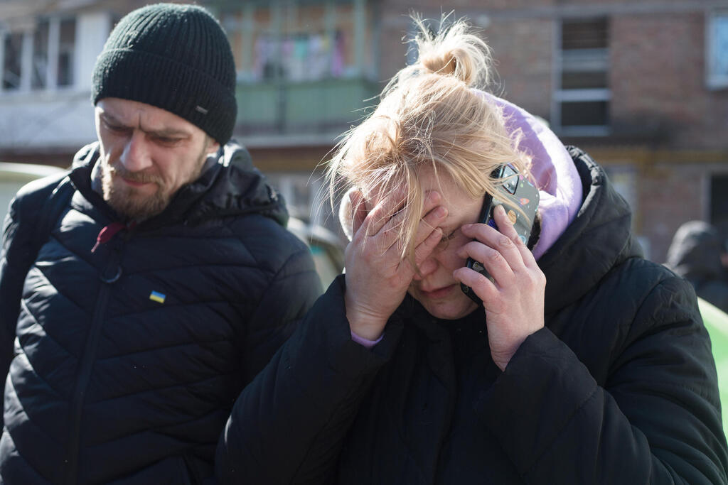 Residents of Kyiv distraught after residential area bombed by Russian invasion forces on Friday 