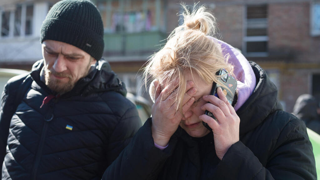 Residents of Kyiv distraught after residential area bombed by Russian invasion forces on Friday (Photo: Getty Images) Residents of Kyiv distraught after residential area bombed by Russian invasion forces on Friday