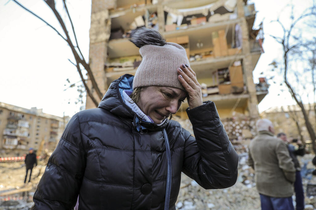 A resident of Kyiv distressed following Russian bombing of her city 