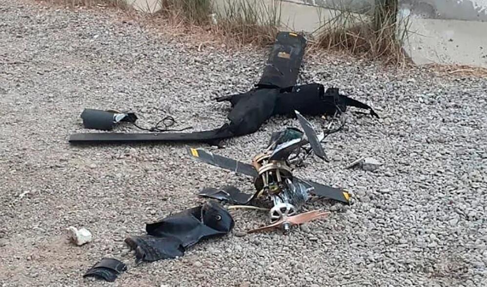 Wreckage of a drone lying on the ground at the airport in Baghdad, Iraq, January 3, 2022 