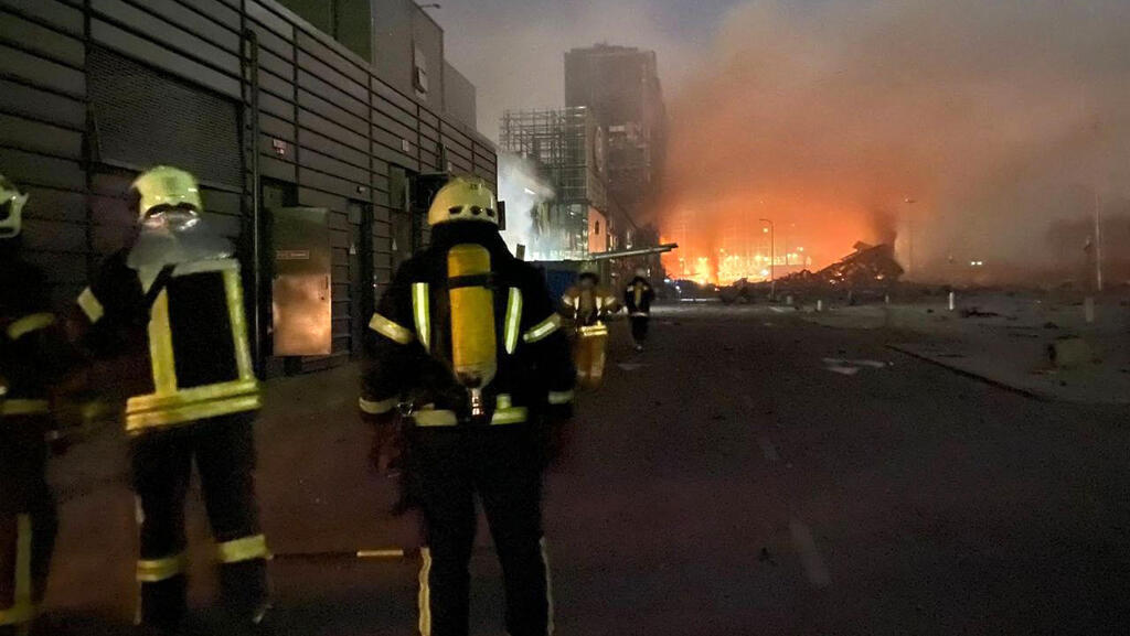 Fire breaks out following Russian bombing of a shopping center in Kyiv late on Sunday 