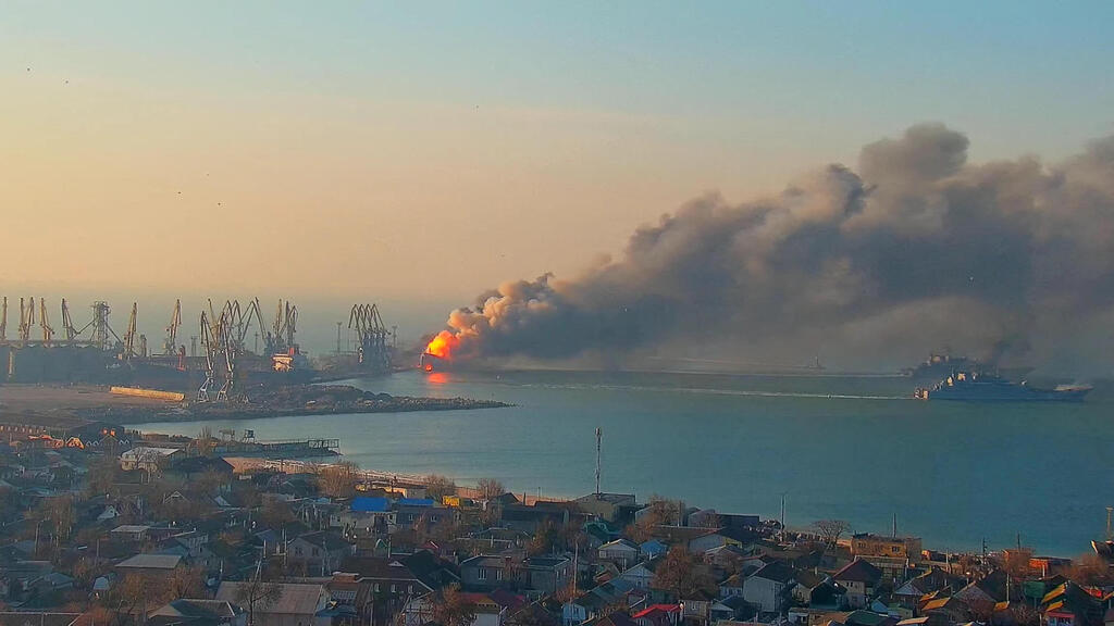 Fire from what Ukraine said was a Russian ship destroyed at the port of Berdiansk on Thursday 